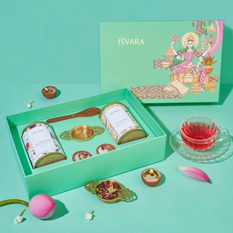 Isvara Prosperity Gift Set | Pack of 2 Tea Tins (Each of 250 gms), 1 Brass Strainer, 1 Sheesham Wood Spoon, and 2 Candles